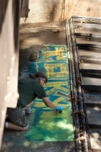 Peggy removing graffiti