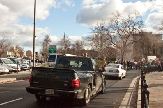 Still in silent protest, marchers block traffic by Children's Park