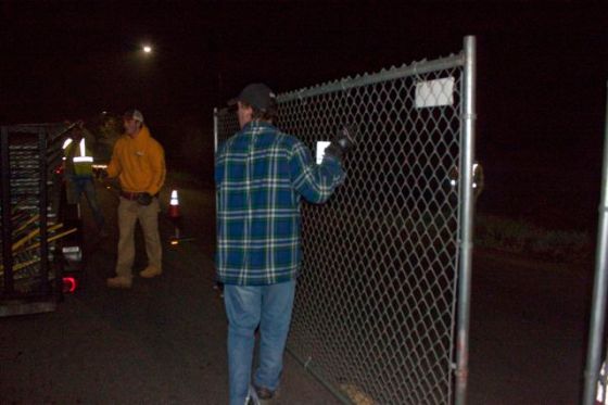 PG&E puts up fence around the trees and the people guarding the trees.