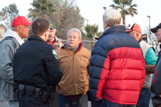 The people discuss risking arrest with the police.