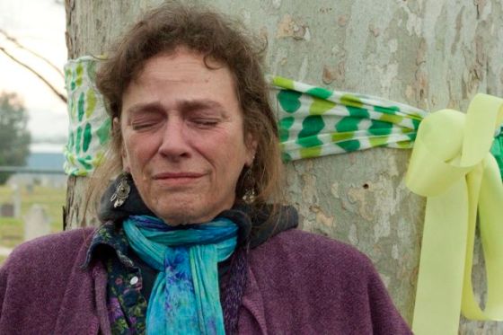 A woman cries before being cited and removed.