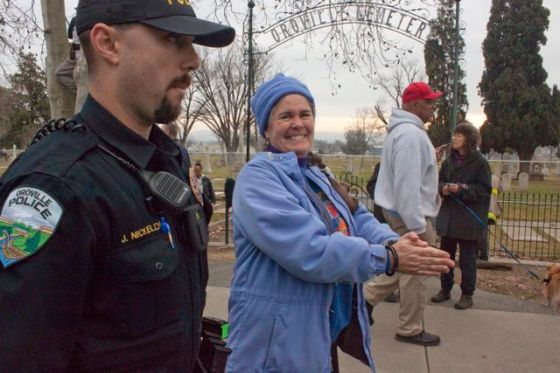 Caroline gets cited and escorted out of fenced area around the trees.