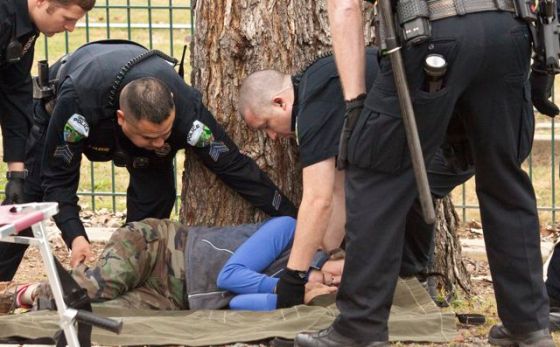 Woman returns to fenced-off area and is arrested.