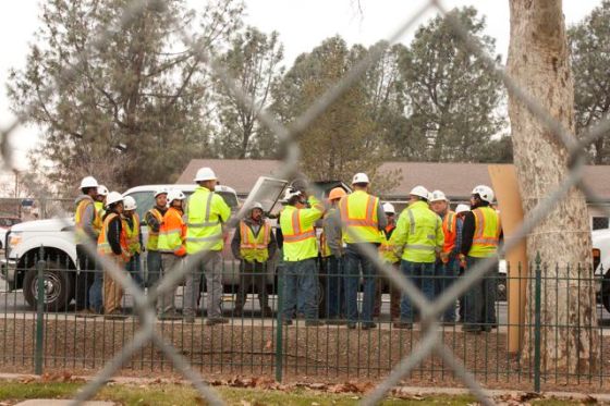 PG&E workers huddle.