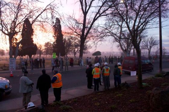 PG&E employees on the outside of the fence.