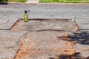Old patched pot-hole.